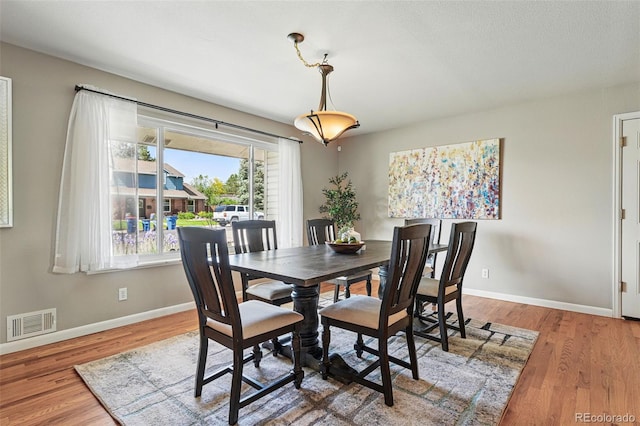3570 E Arapahoe Pl, Centennial, CO 80122 - dining area featuring baseboards and light wood finished floors