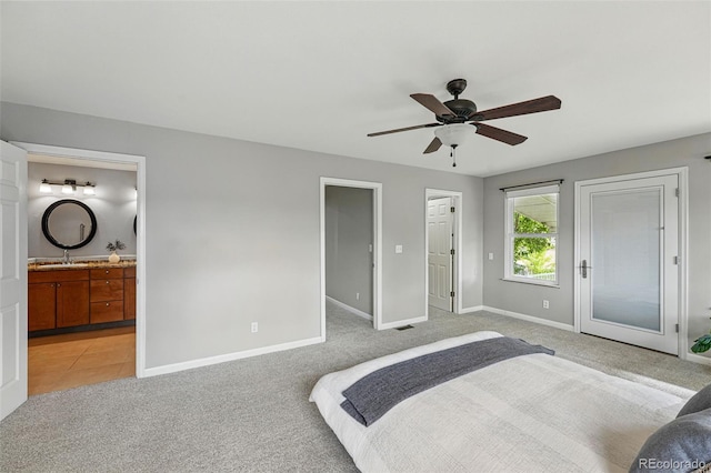3570 E Arapahoe Pl, Centennial, CO 80122 - bedroom with a sink, light carpet, baseboards, and connected bathroom