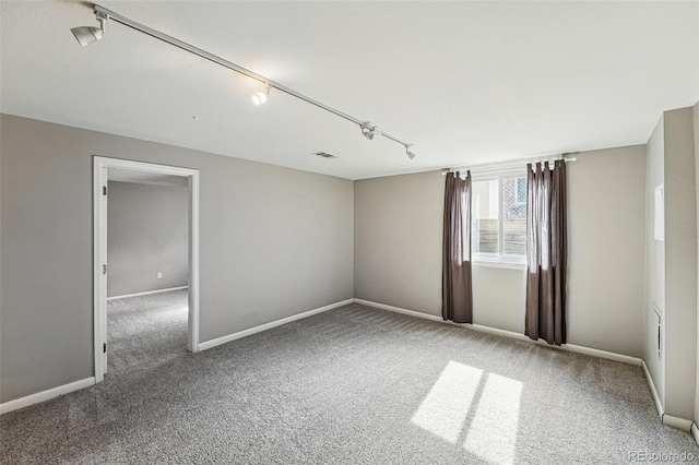 3570 E Arapahoe Pl, Centennial, CO 80122 - carpeted spare room featuring rail lighting and baseboards