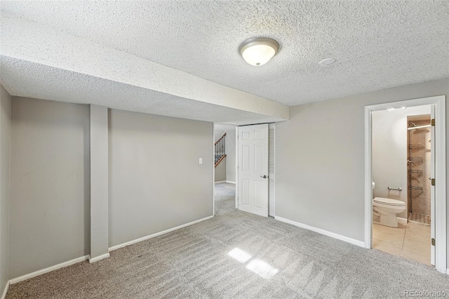 3570 E Arapahoe Pl, Centennial, CO 80122 - finished basement with carpet, a textured ceiling, baseboards, and stairway