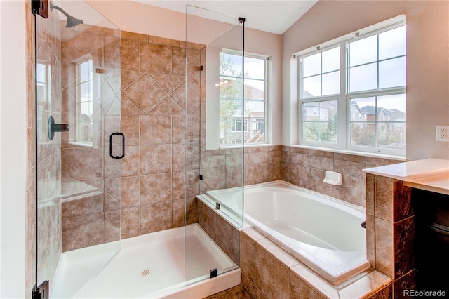 5597 S Buchanan St, Aurora, CO 80016 - bathroom with a bath, a shower stall, and vaulted ceiling