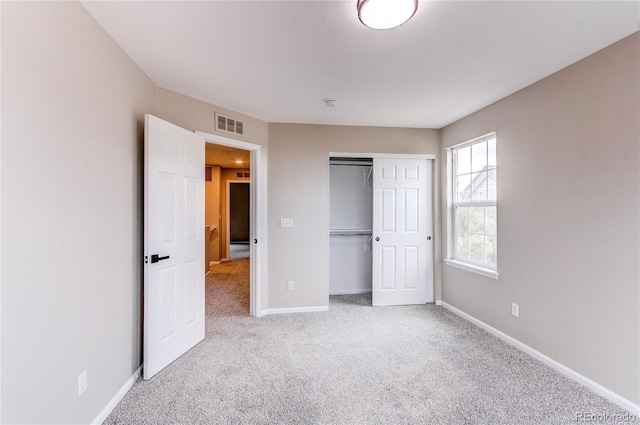 5597 S Buchanan St, Aurora, CO 80016 - unfurnished bedroom featuring carpet floors, baseboards, and a closet