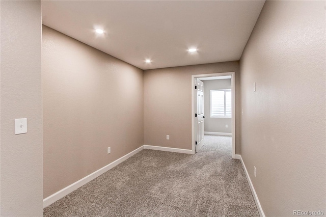 5597 S Buchanan St, Aurora, CO 80016 - carpeted spare room featuring baseboards and recessed lighting