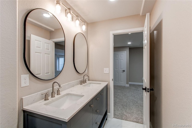 5597 S Buchanan St, Aurora, CO 80016 - bathroom with double vanity and baseboards