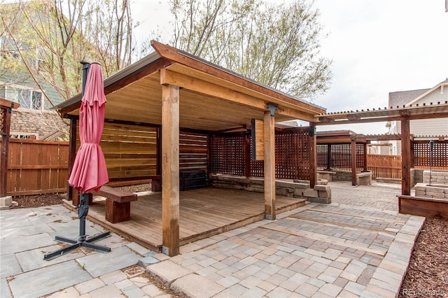 5597 S Buchanan St, Aurora, CO 80016 - wooden terrace with a patio and a fenced backyard