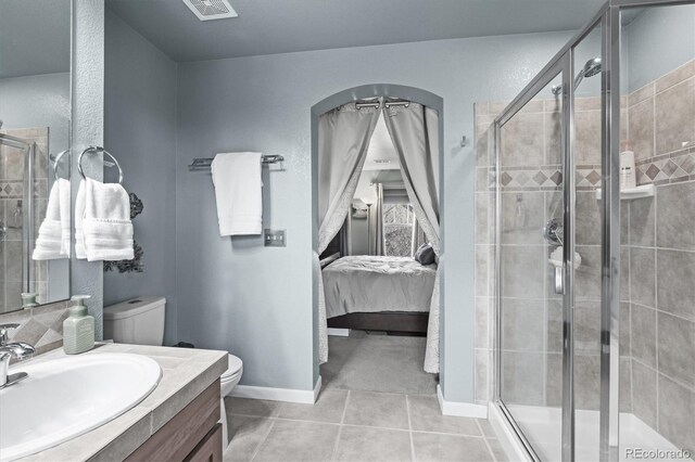ensuite bathroom with visible vents, vanity, toilet, connected bathroom, and a shower stall