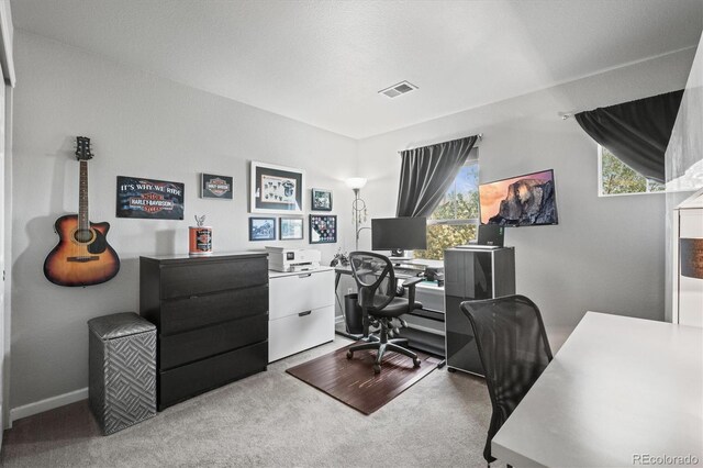 carpeted office featuring visible vents