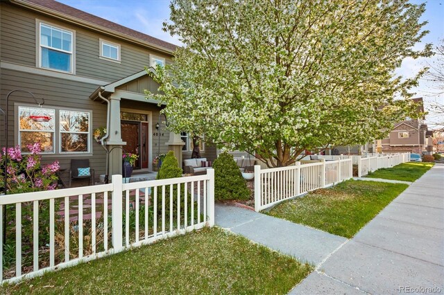 view of front of house with fence private yard and covered porch