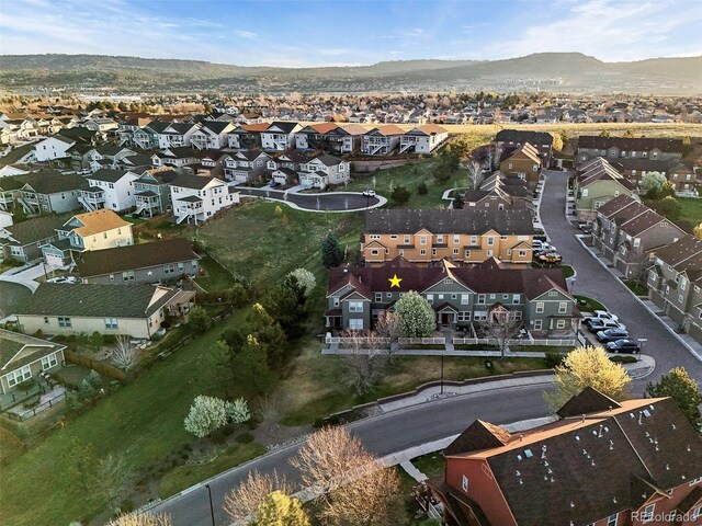 drone / aerial view with a residential view and a mountain view