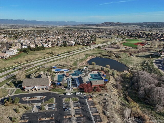 bird's eye view with a residential view and a water and mountain view