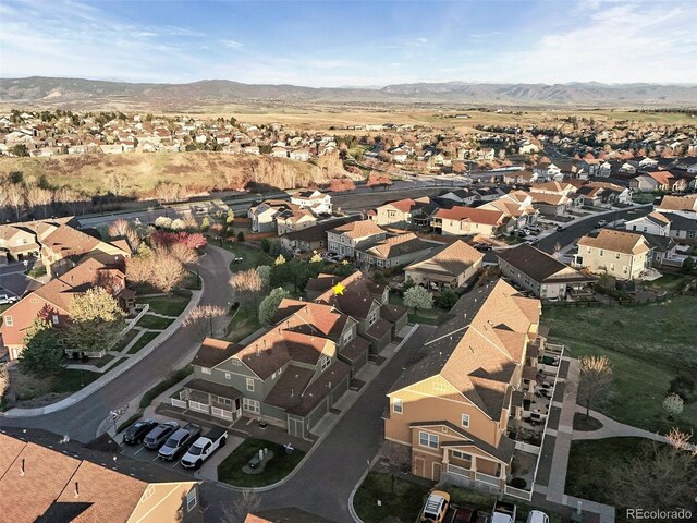 birds eye view of property featuring a mountain view and a residential view