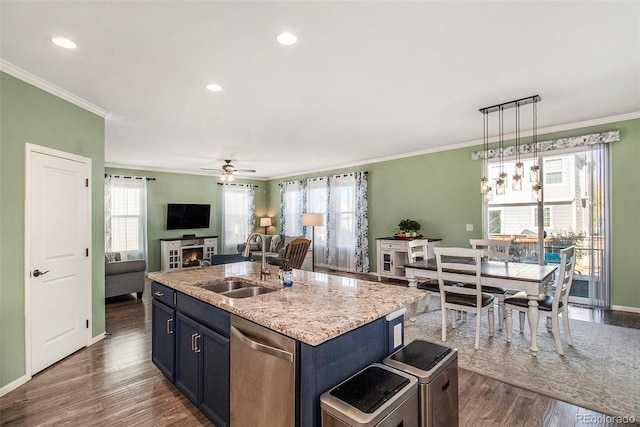 kitchen featuring dark hardwood / wood-style flooring, stainless steel dishwasher, a kitchen island with sink, and sink