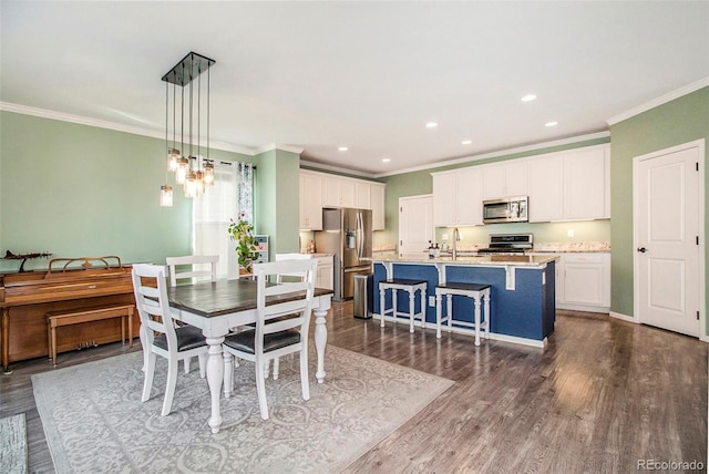 dining space featuring dark hardwood / wood-style flooring and ornamental molding