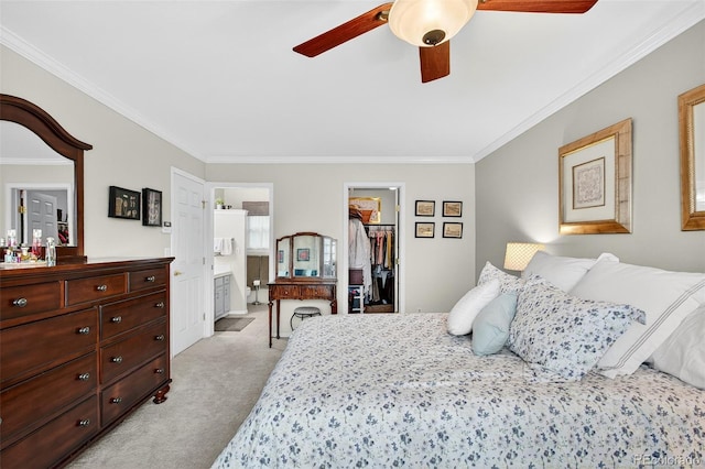 10328 W Crestone Mtn, Littleton, CO 80127 - bedroom with light colored carpet, crown molding, a spacious closet, ensuite bathroom, and ceiling fan