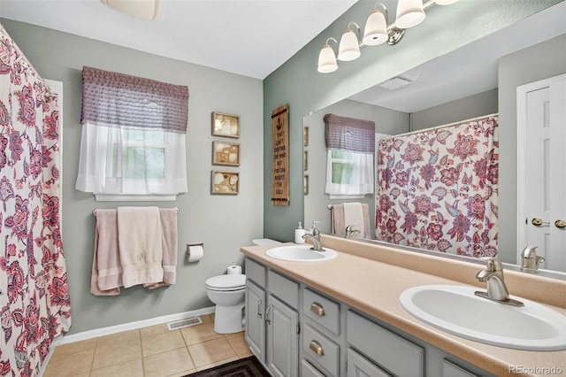 10328 W Crestone Mtn, Littleton, CO 80127 - full bath featuring double vanity, tile patterned flooring, and a shower with curtain