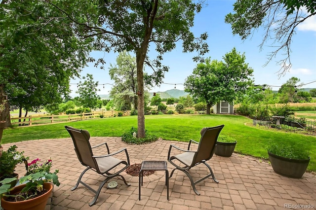10328 W Crestone Mtn, Littleton, CO 80127 - view of patio featuring a shed and a mountain view