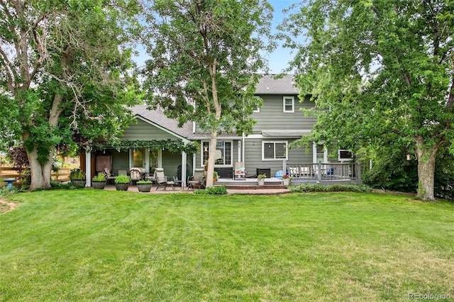 10328 W Crestone Mtn, Littleton, CO 80127 - rear view of property with a lawn and a shingled roof
