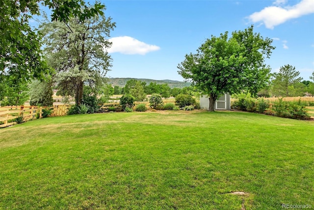 10328 W Crestone Mtn, Littleton, CO 80127 - view of yard with a mountain view and an outbuilding