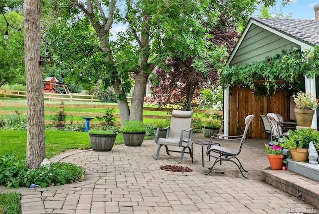 10328 W Crestone Mtn, Littleton, CO 80127 - view of patio featuring a playground