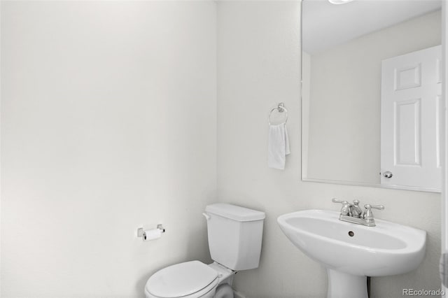 701 N Roslyn St Unit 36, Denver, CO 80230 - half bath featuring toilet and a sink