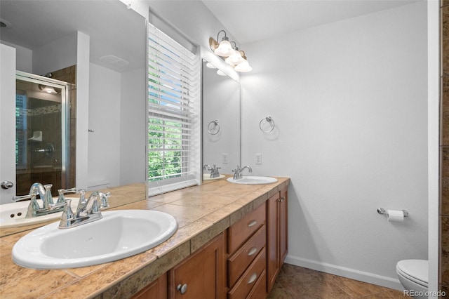 701 N Roslyn St Unit 36, Denver, CO 80230 - full bath featuring toilet, a shower stall, double vanity, and baseboards