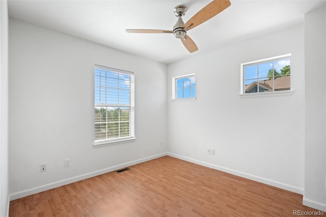 701 N Roslyn St Unit 36, Denver, CO 80230 - spare room featuring light wood-style floors, baseboards, and a ceiling fan