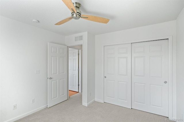 701 N Roslyn St Unit 36, Denver, CO 80230 - unfurnished bedroom featuring light carpet, baseboards, a closet, and ceiling fan