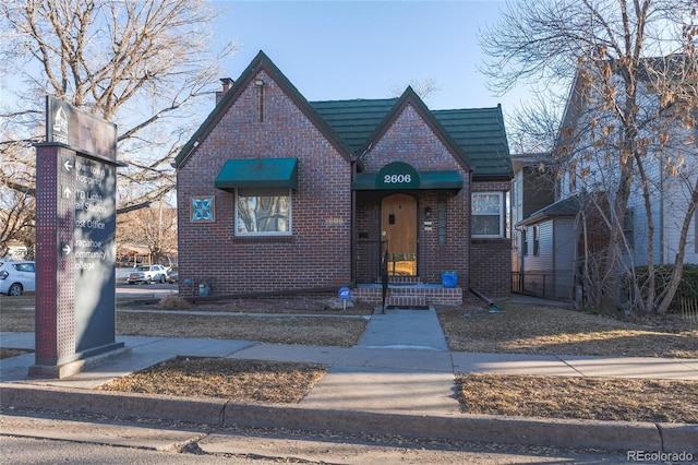 view of front of property featuring brick siding