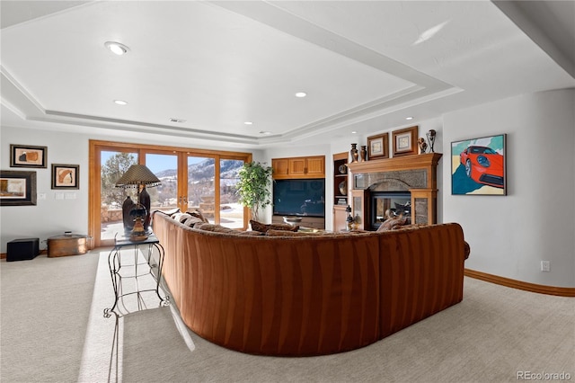 living room featuring light carpet, french doors, and a raised ceiling