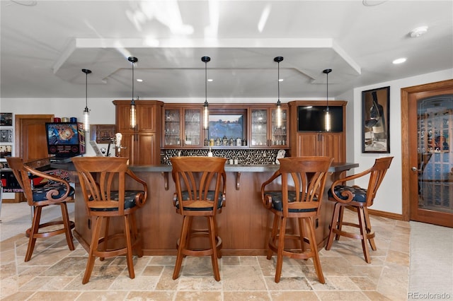 bar featuring pendant lighting