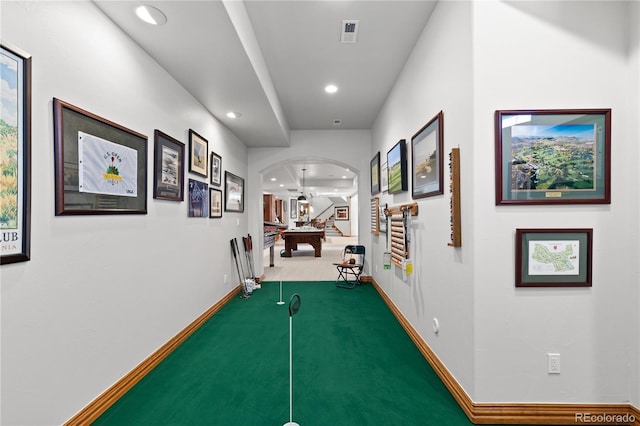 corridor with carpet flooring