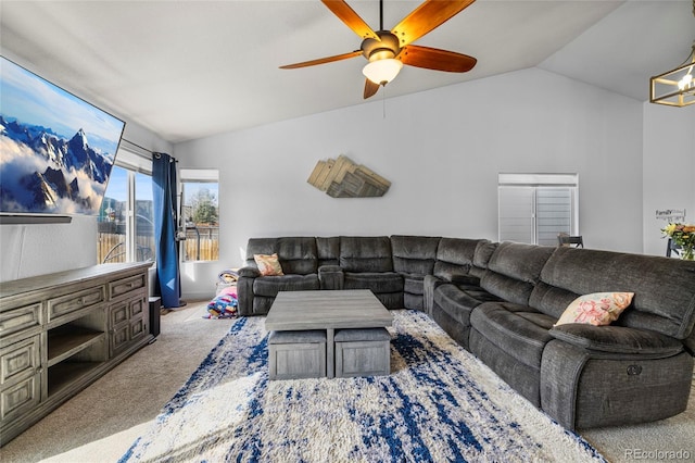 living area with carpet floors, ceiling fan with notable chandelier, and vaulted ceiling