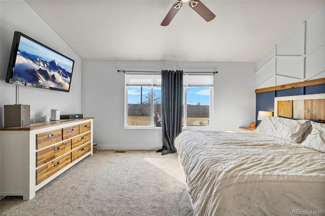 bedroom featuring baseboards, lofted ceiling, carpet, and ceiling fan