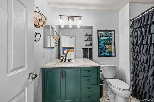 bathroom with vanity, toilet, and a shower with curtain