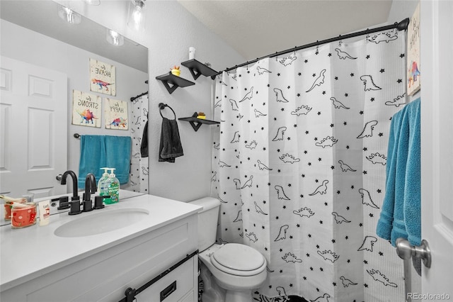 bathroom featuring vanity, a shower with shower curtain, and toilet