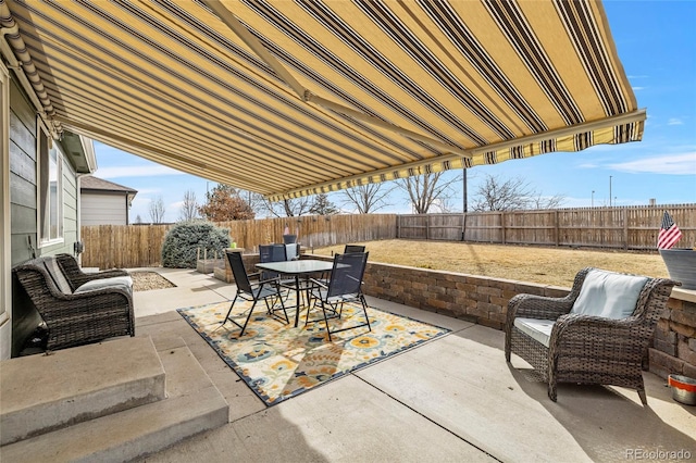 view of patio / terrace with outdoor dining area and a fenced backyard