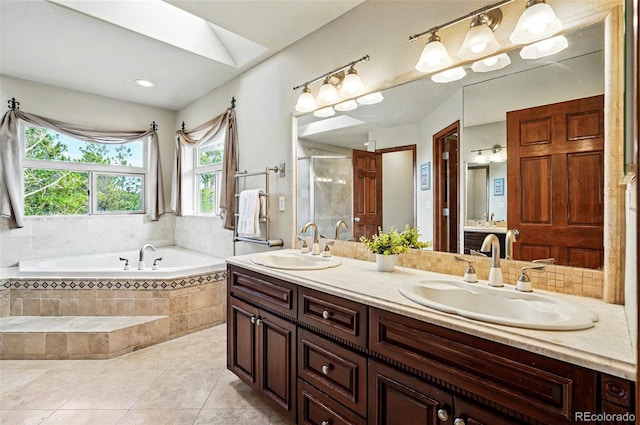 19640 Four Winds Way, Monument, CO 80132 - bathroom featuring a garden tub, double vanity, tile patterned floors, and a shower with door