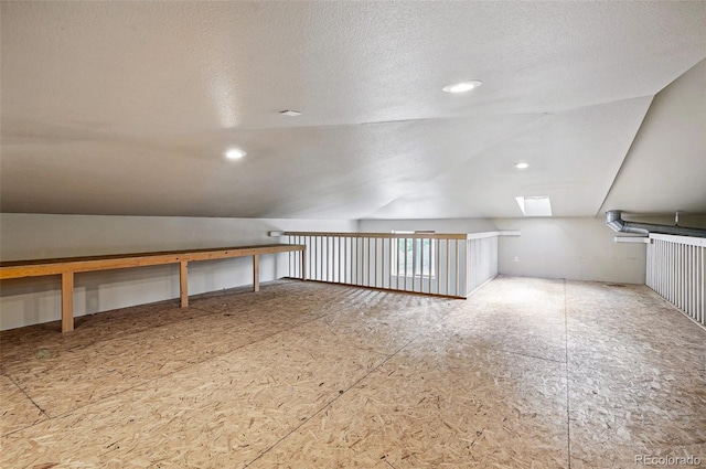 19640 Four Winds Way, Monument, CO 80132 - bonus room featuring a skylight, lofted ceiling, and a textured ceiling