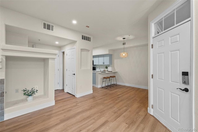 9590 E Florida Ave Unit 1025, Denver, CO 80247 - living room with baseboards, light wood finished floors, and recessed lighting