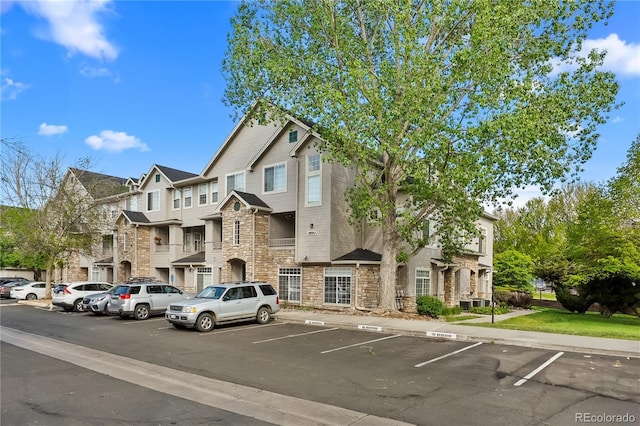 9590 E Florida Ave Unit 1025, Denver, CO 80247 - view of building exterior with uncovered parking