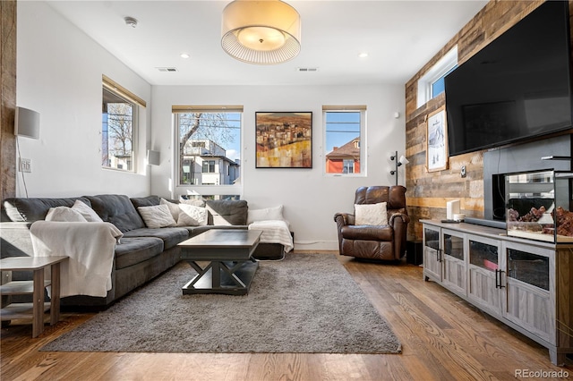1930 W 35th Ave, Denver, CO 80211 - living room featuring wood finished floors, healthy amount of natural light, recessed lighting, and baseboards