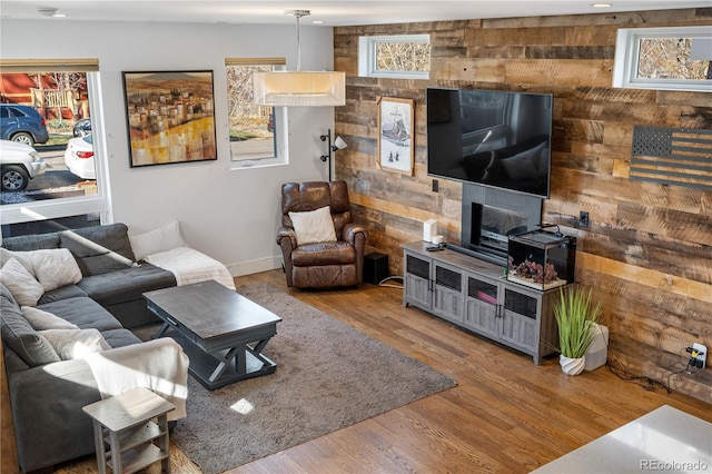 1930 W 35th Ave, Denver, CO 80211 - living room with wooden walls, wood finished floors, and healthy amount of natural light