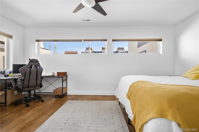 1930 W 35th Ave, Denver, CO 80211 - bedroom featuring wood finished floors, a ceiling fan, and baseboards