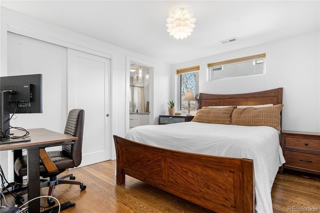 1930 W 35th Ave, Denver, CO 80211 - bedroom with wood finished floors, a closet, and a desk