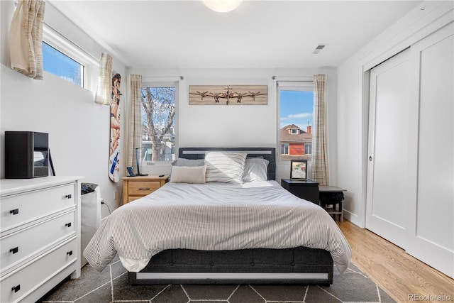 1930 W 35th Ave, Denver, CO 80211 - bedroom featuring wood finished floors and a closet