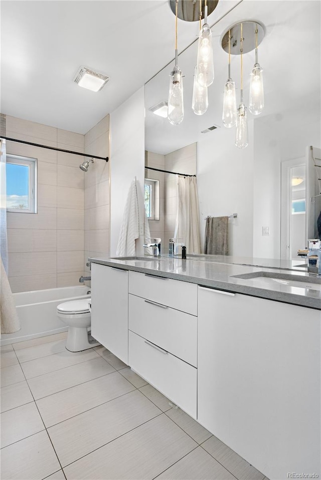 1930 W 35th Ave, Denver, CO 80211 - full bath with tile patterned flooring, vanity, toilet, and shower / tub combo