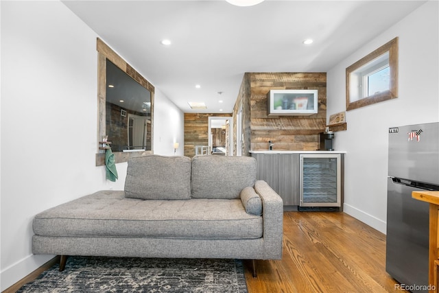 1930 W 35th Ave, Denver, CO 80211 - living room with beverage cooler, bar with sink, baseboards, wood finished floors, and recessed lighting