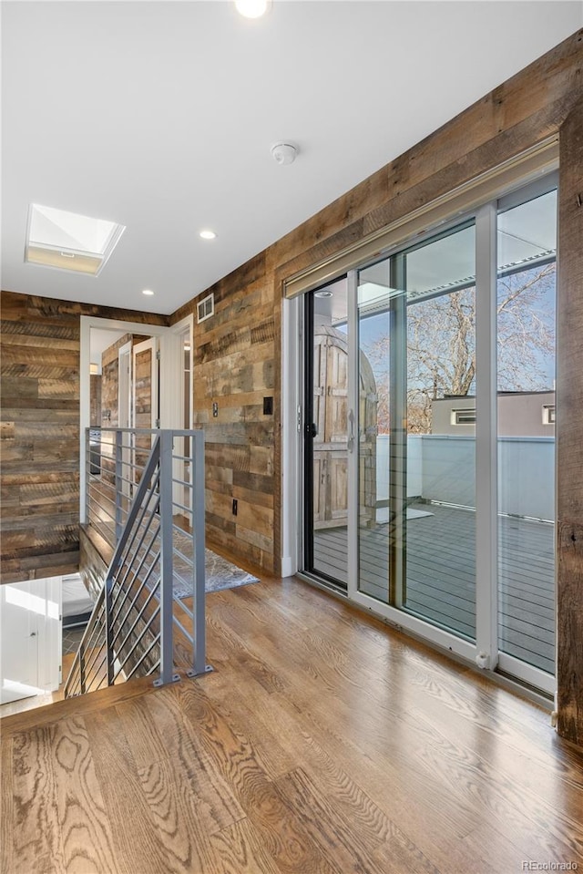 1930 W 35th Ave, Denver, CO 80211 - unfurnished room featuring wood walls, a skylight, wood finished floors, and recessed lighting