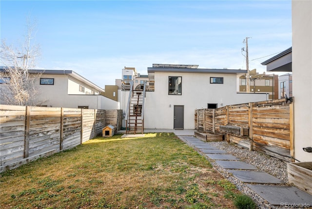 1930 W 35th Ave, Denver, CO 80211 - rear view of house featuring stucco siding and stairway