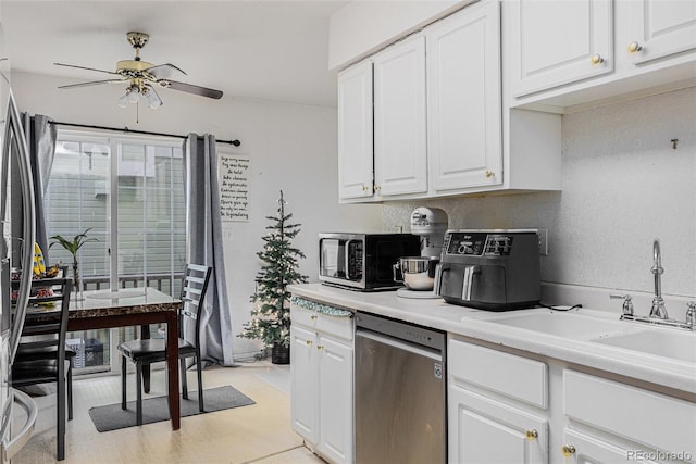1655 S Buckley Cir, Aurora, CO 80017 - kitchen featuring stainless steel appliances, a ceiling fan, white cabinets, a sink, and light countertops